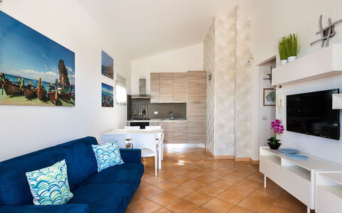 Unterkunft Calantha: Esszimmer, Küche, Wohnzimmer