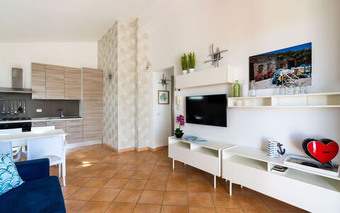 Unterkunft Calantha: Esszimmer, Küche, Wohnzimmer